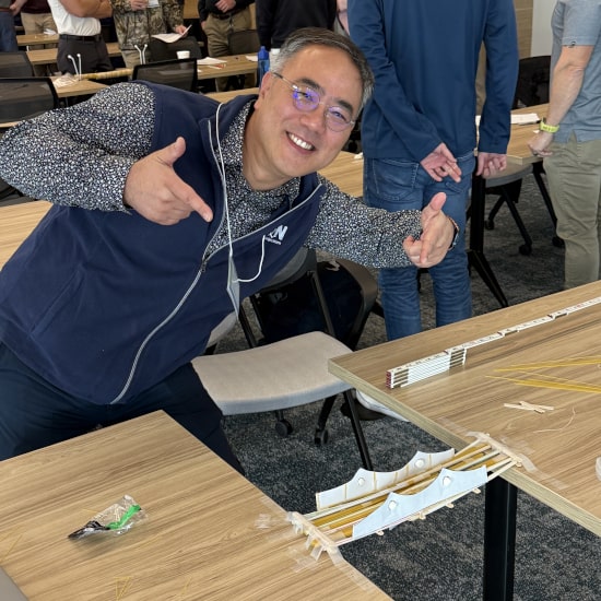Employee showcasing bridge activity