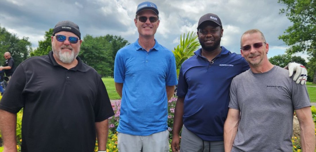 Columbus employees enjoying a golfing event